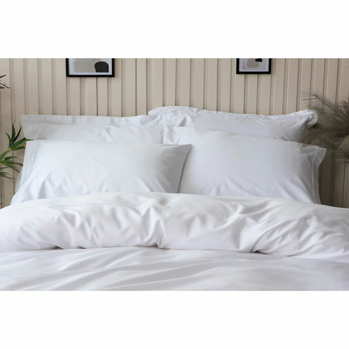 Pure white Belledorm bamboo cotton duvet cover set neatly dressed on a bed showing off its smooth, silky finish.