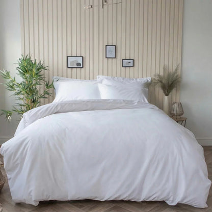 Pure white Belledorm bamboo cotton duvet cover set neatly dressed on a bed showing off its smooth, silky finish.
