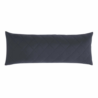 Below Zero cooling body pillow in a soft neutral tone with a textured circular-knit cover resting on a contemporary bed setting.