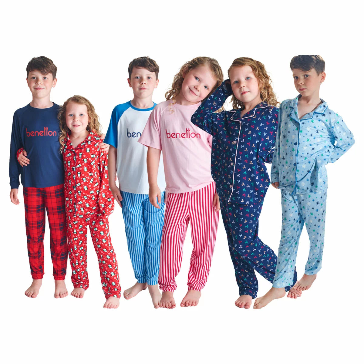Flat lay view of the United Colours of Benetton Kids 4 Piece Pyjama Set showing vibrant blue, red, and navy printed long-sleeve tops and matching bottoms on a clean white background.