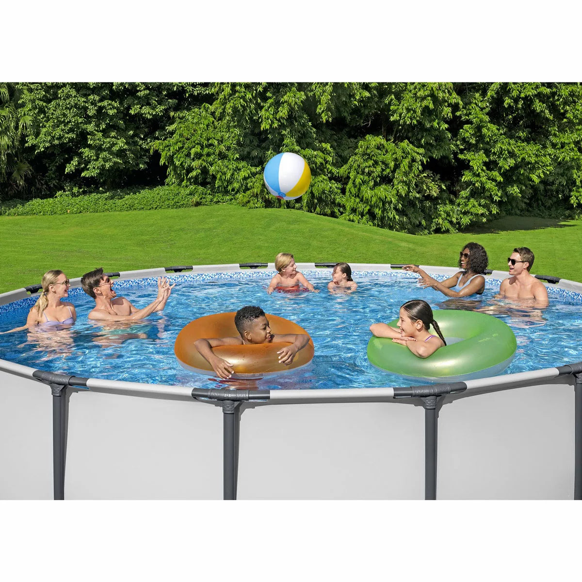 Bestway Steel Pro MAX 15ft round above ground swimming pool with durable steel frame, Prismatic Stone interior liner, and filter pump set up in a family garden for summer outdoor fun.