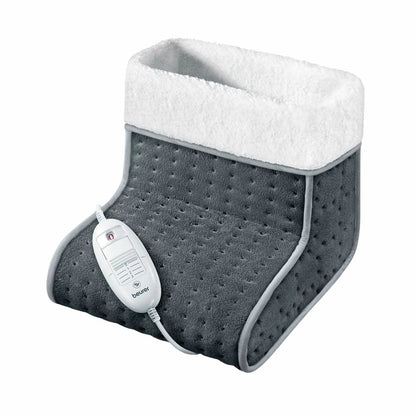 The Beurer FW20 electric foot warmer in its cozy teddy fleece finish, showcasing the soft-touch exterior and heating controller.