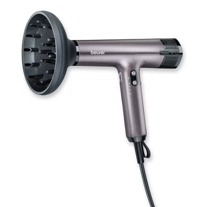 Beurer Excellence digital hair dryer HC100-10084 in a sleek matte purple finish showcasing its compact nozzle and ergonomic handle.