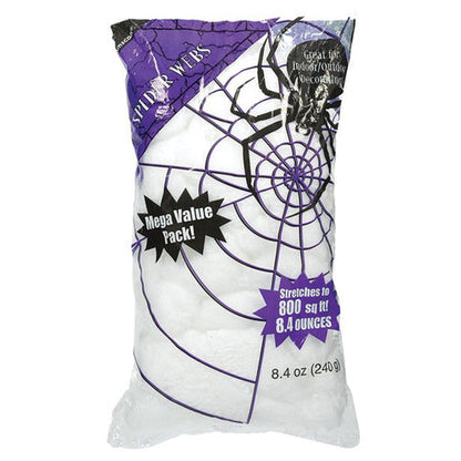 Dense white 240g stretch spider web material stretched intricately across a dark wooden porch for Halloween decorating.