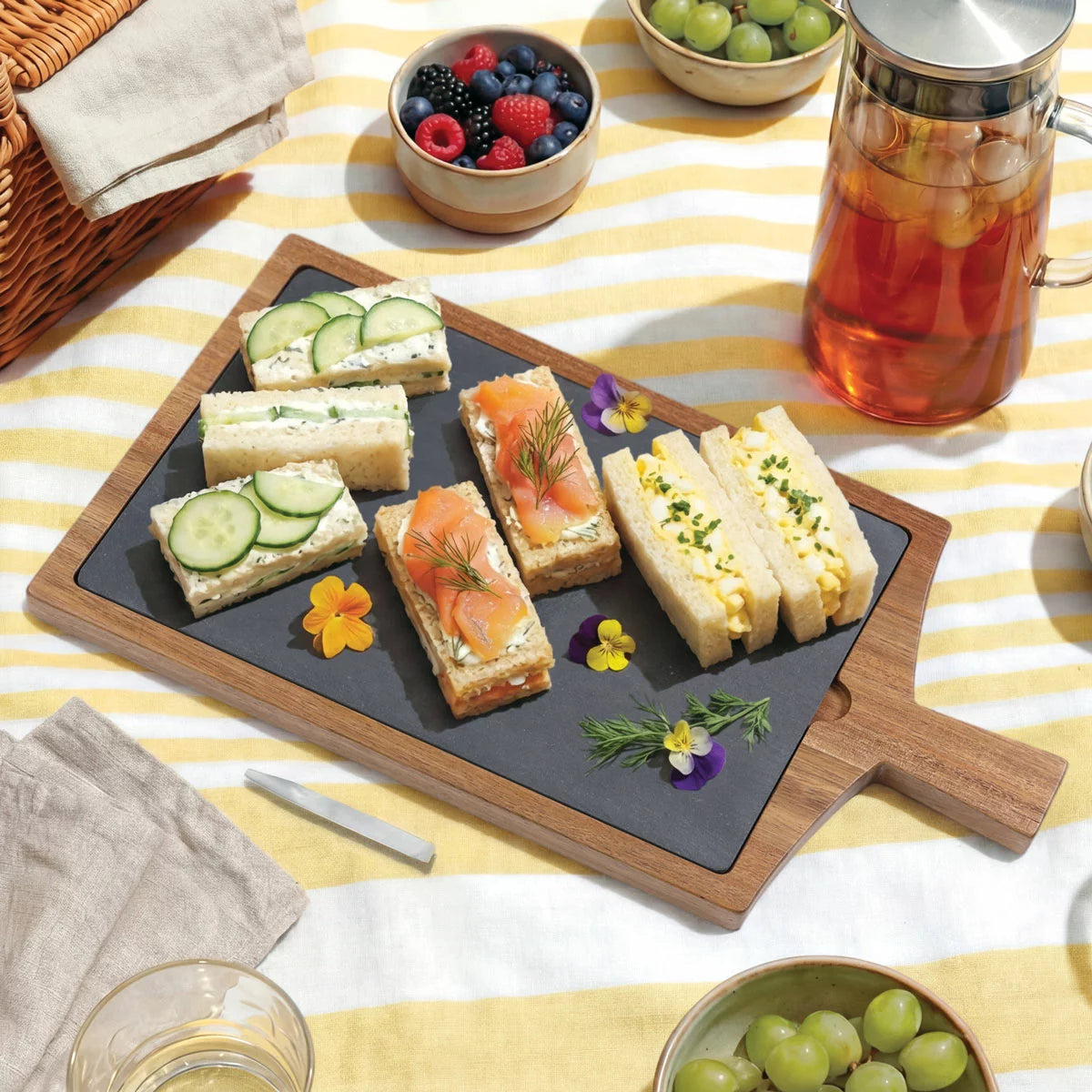 BirdRock Home Acacia hardwood serving board topped with a curated charcuterie selection.