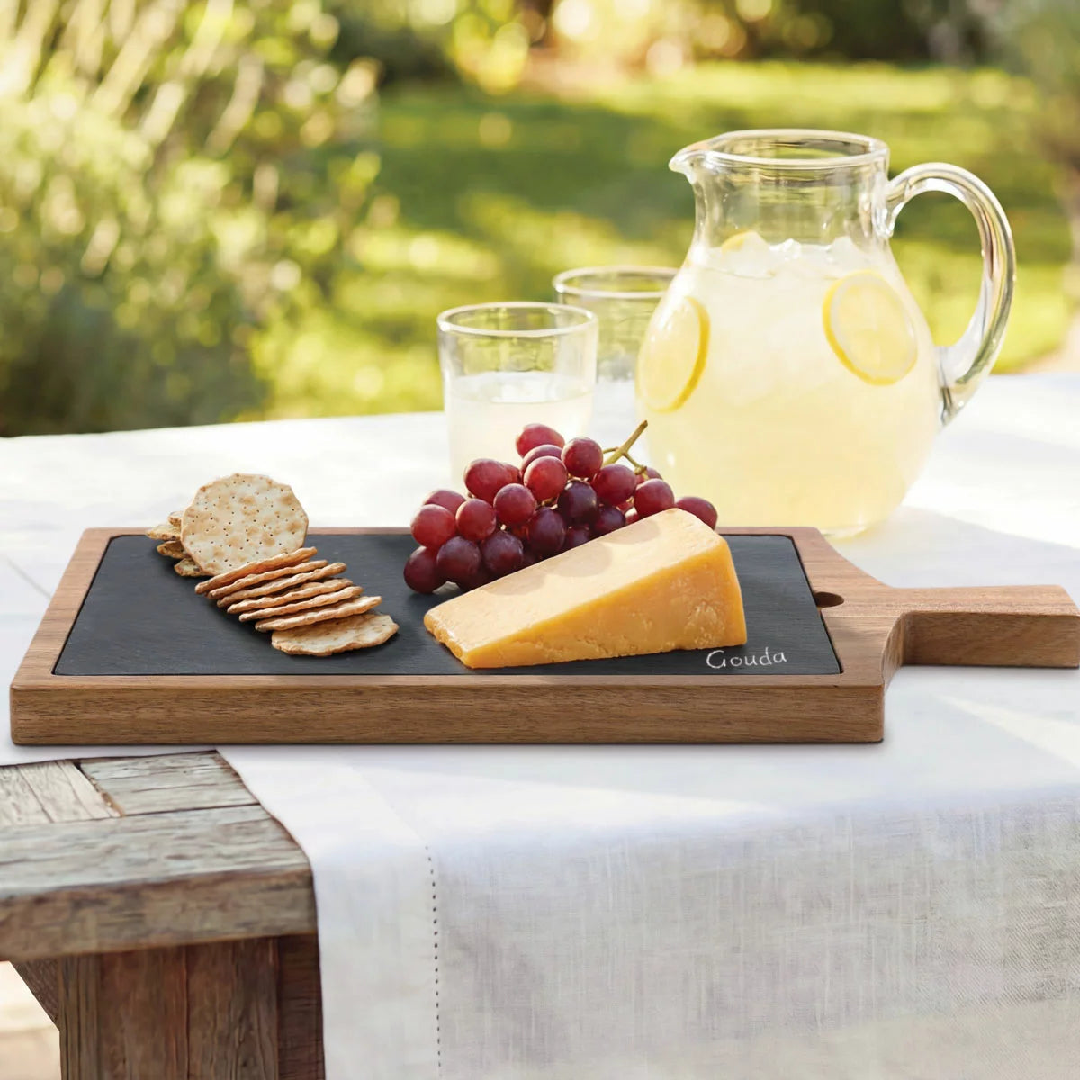 BirdRock Home Acacia hardwood serving board topped with a curated charcuterie selection.