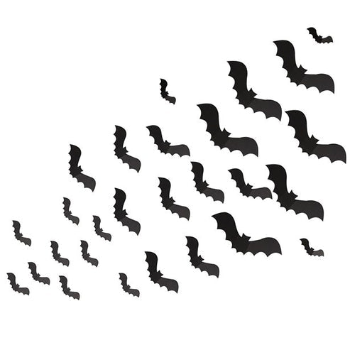Matte black 3D paper bat cutouts in various sizes arranged on a white wall in a flying swarm pattern.