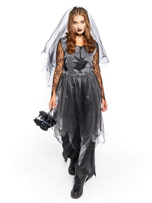 Adult female model wearing the Black Corpse Bride Halloween costume with tattered lace veil standing in dark gothic studio lighting.