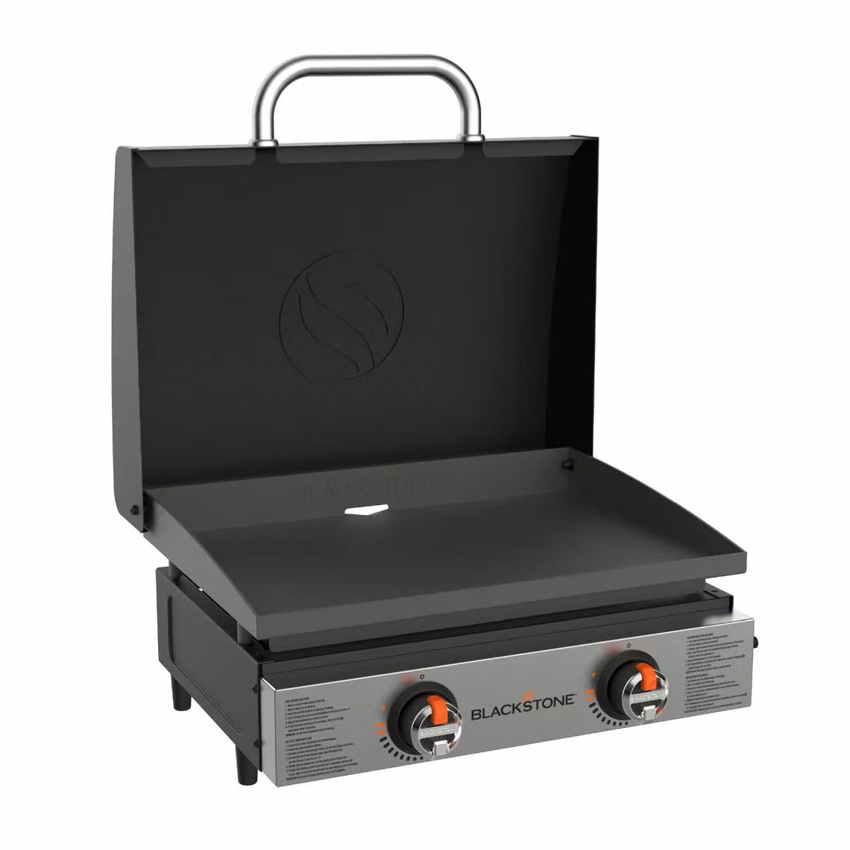 Angle view of the black Blackstone 22 inch tabletop gas griddle showing the open hood, dual burner dials, and flat steel cooking plate resting on a wooden bench.