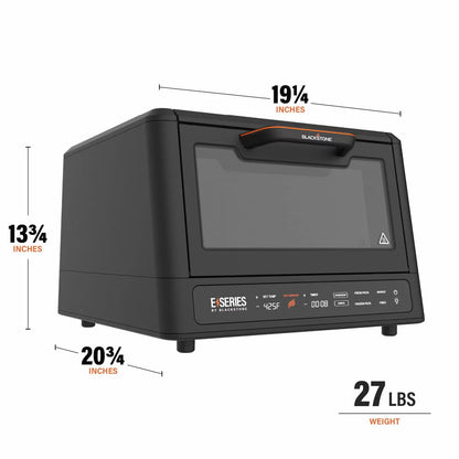 Front view of the black Blackstone E-Series electric pizza and air fryer oven sitting on a kitchen counter displaying its touchscreen control panel and open glass door with a 14 inch rotating deck inside.