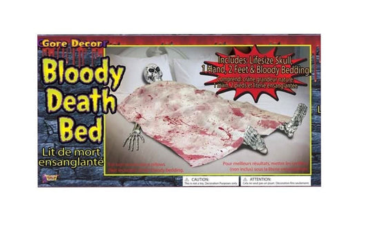 Top-down view of the Bloody Death Bed Skeleton Halloween decoration featuring realistic bloodstains on dark fabric resting on a wooden party table setting.