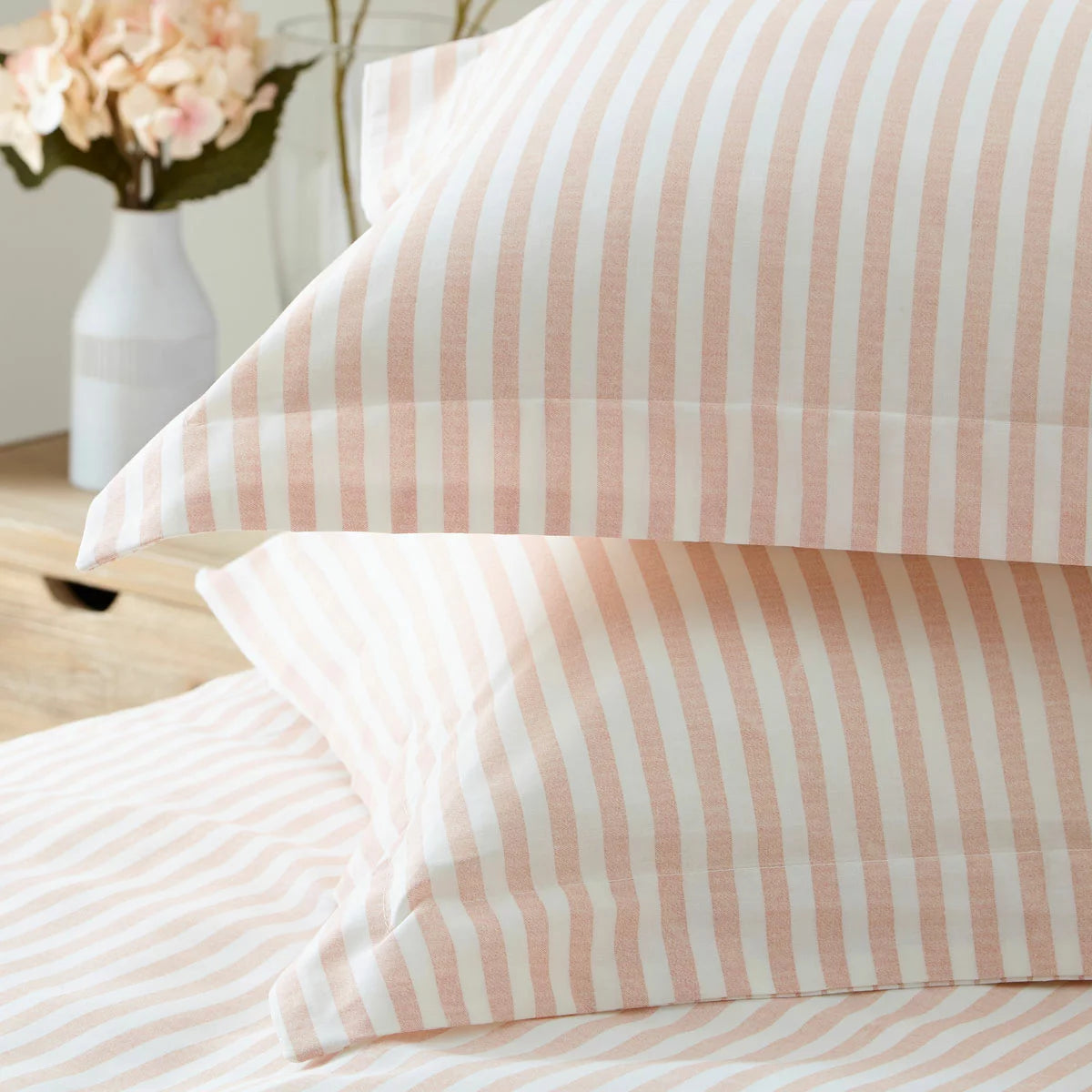 Close-up view of the single Yard Hebden cotton duvet cover in blush pink and white stripes, showing the soft, breathable weave texture.