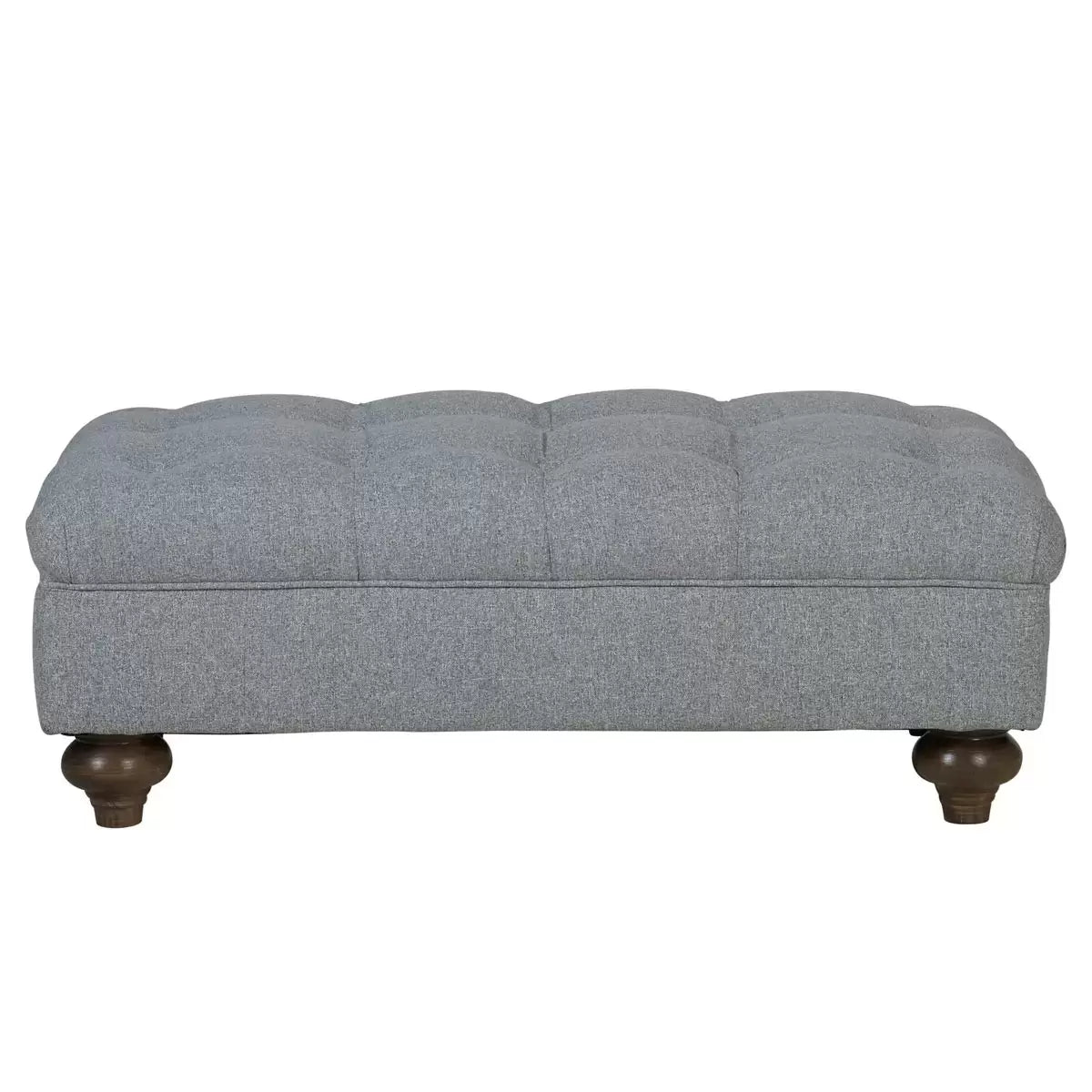 Close-up angle of the grey Bordeaux fabric footstool showing hand-tied button detailing, linen texture, and dark stained wooden legs in a living room setting.