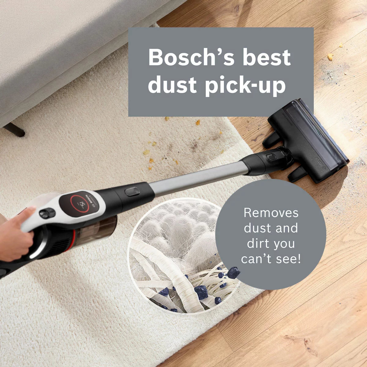 Front view of the sleek white Bosch BBS931WGB Unlimited 9 cordless vacuum cleaner standing upright on grey tile flooring with its blue MicroClean LED indicator glowing.