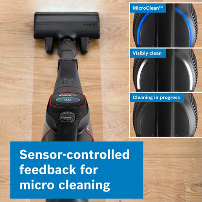 Profile view of the black Bosch BCS1051GB Unlimited 10 ProPower cordless vacuum cleaner with its blue MicroClean LED ring illuminated while cleaning a modern hardwood floor.