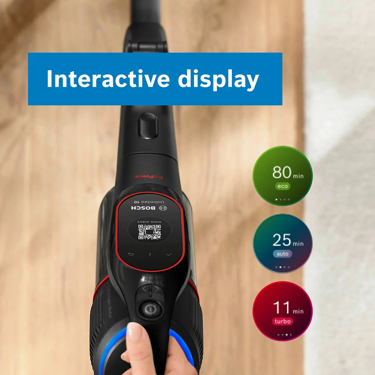 Profile view of the black Bosch BCS1051GB Unlimited 10 ProPower cordless vacuum cleaner with its blue MicroClean LED ring illuminated while cleaning a modern hardwood floor.