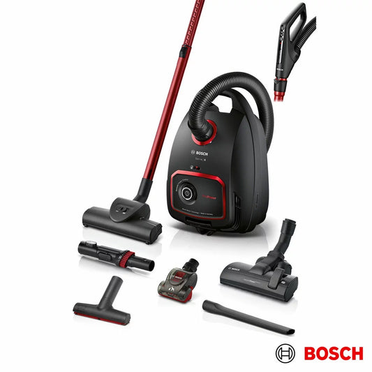Matte black Bosch BGL6POWGB Series 6 Pro Power cylinder vacuum cleaner on wood floor showing ergonomic remote handle and turbo brush head attachment.