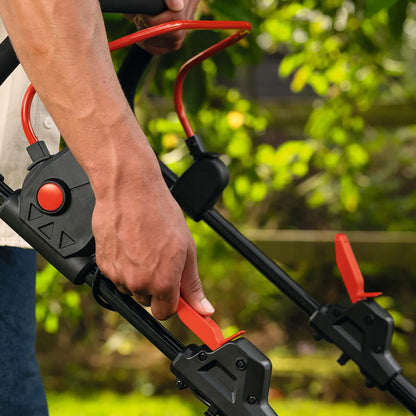 Bosch Rotak 36V cordless lawnmower with 43cm cutting width mowing a well-maintained residential garden