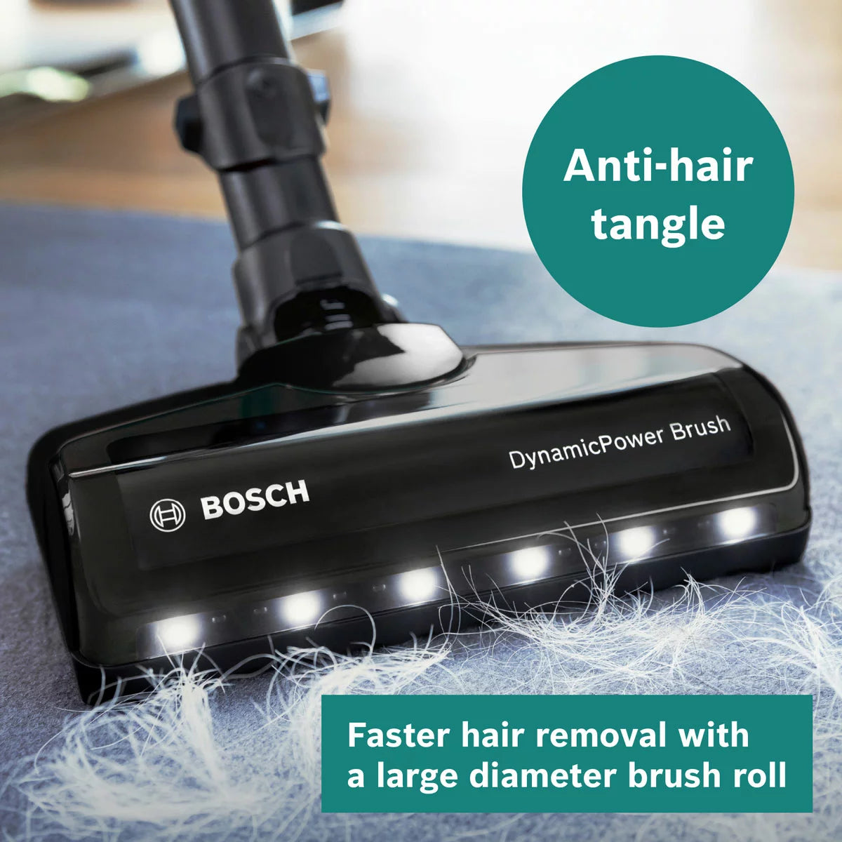 Front view of the white and turquoise Bosch Unlimited 7 Aqua cordless vacuum cleaner standing on light timber flooring with its dual spinning mop head and turquoise accents exposed.