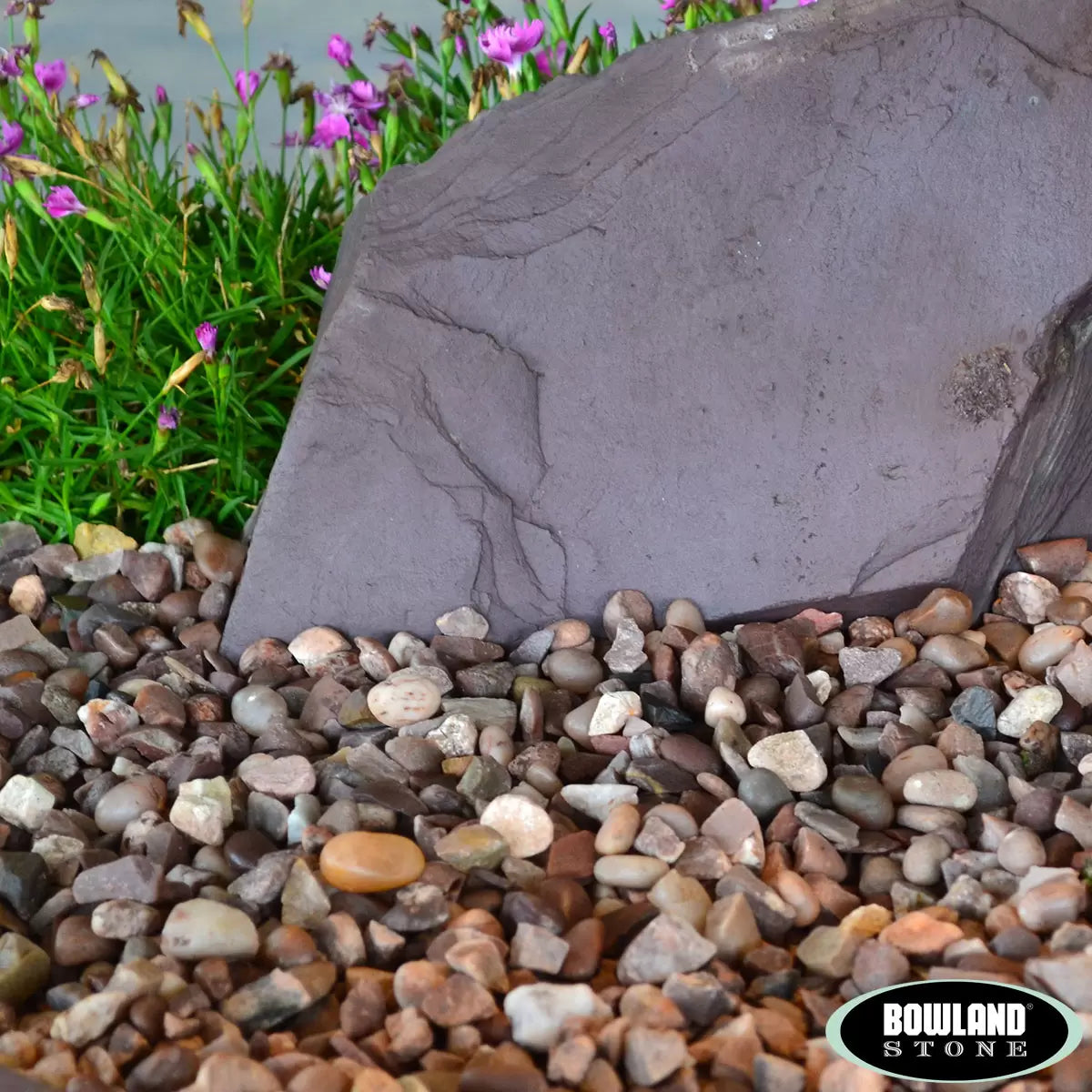 Smooth, rounded Huntleywood 14-20mm decorative pebbles in a 750kg bulk bag for garden landscaping.