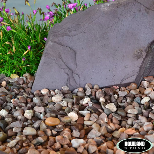 Smooth, rounded Huntleywood 14-20mm decorative pebbles in a 750kg bulk bag for garden landscaping.
