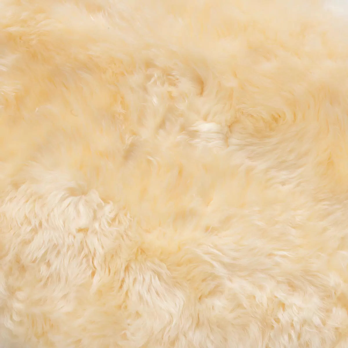 Bowron Lambskin Longwool Baby Rug in cream white used as a plush nursery play mat.