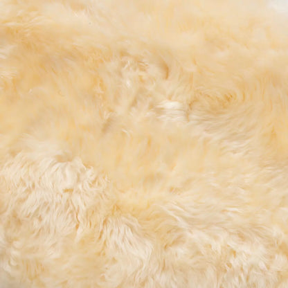 Bowron Lambskin Longwool Baby Rug in cream white used as a plush nursery play mat.