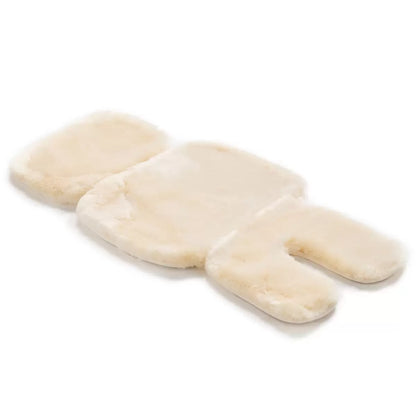 A soft, natural cream-colored Bowron lambskin stroller liner laid flat in a neutral setting to showcase the density and texture of the short wool pile.