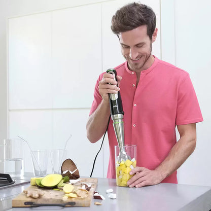 The Braun MultiQuick 9 MQ9187XLI hand blender base shown with its full array of professional-grade attachments, including the 2L food processor and stainless steel whisk on a clean kitchen surface.