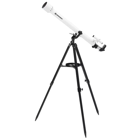 Bresser AZ Classic 900mm Refractor Telescope mounted on a tall aluminum tripod with smartphone adapter attached against a dark evening sky.