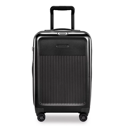 Front studio angle of the glossy Briggs & Riley Sympatico Domestic Carry-On Expandable Spinner Case showing the telescoping aluminium handle, TSA lock, and dual spinner wheels.