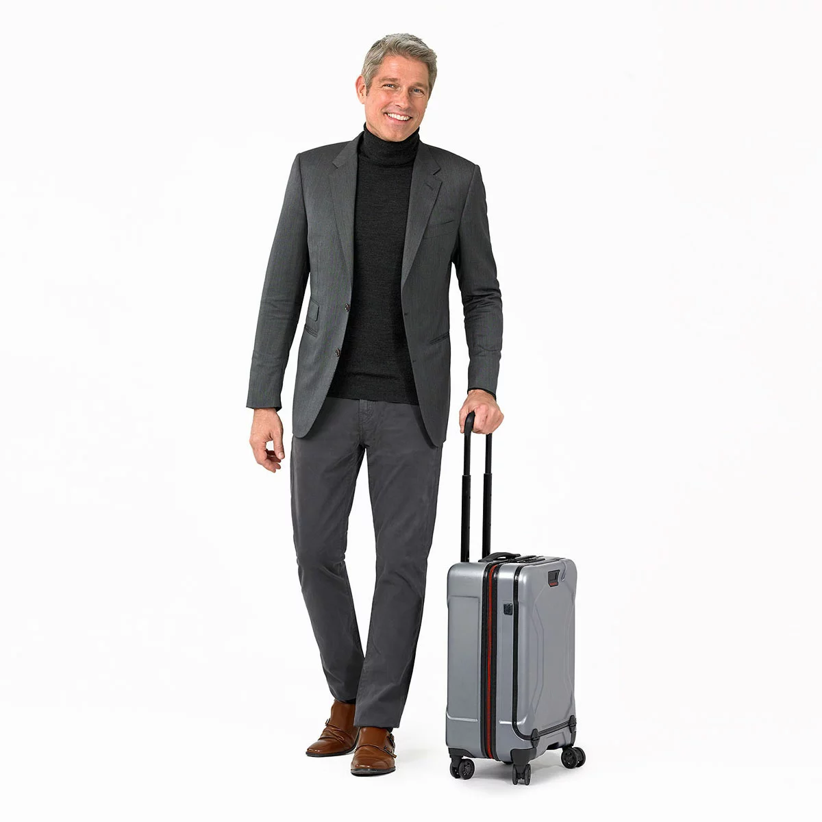 Sleek graphite grey Briggs & Riley Torq 53cm carry-on spinner suitcase showing its open hinged front pocket with a laptop inserted inside.