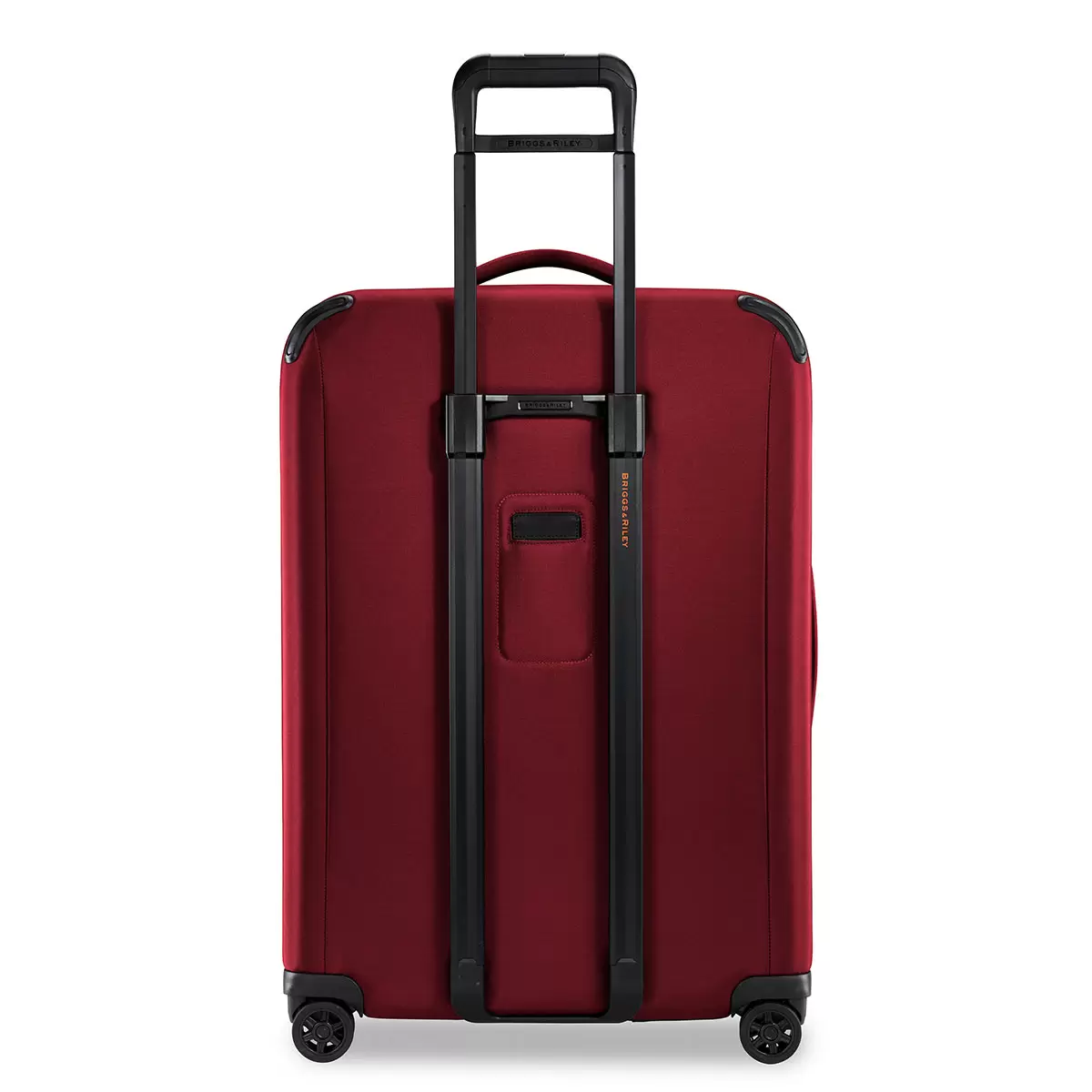 Front angle view of the black Briggs & Riley ZDX 74cm Large Expandable Spinner Suitcase showing exterior front zip pockets, rugged corner guards, and smooth spinner wheels against a crisp white background.