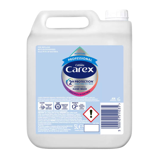 A 5L white bottle of Carex Professional Moisture Handwash standing in a clean, brightly lit professional washroom setting.