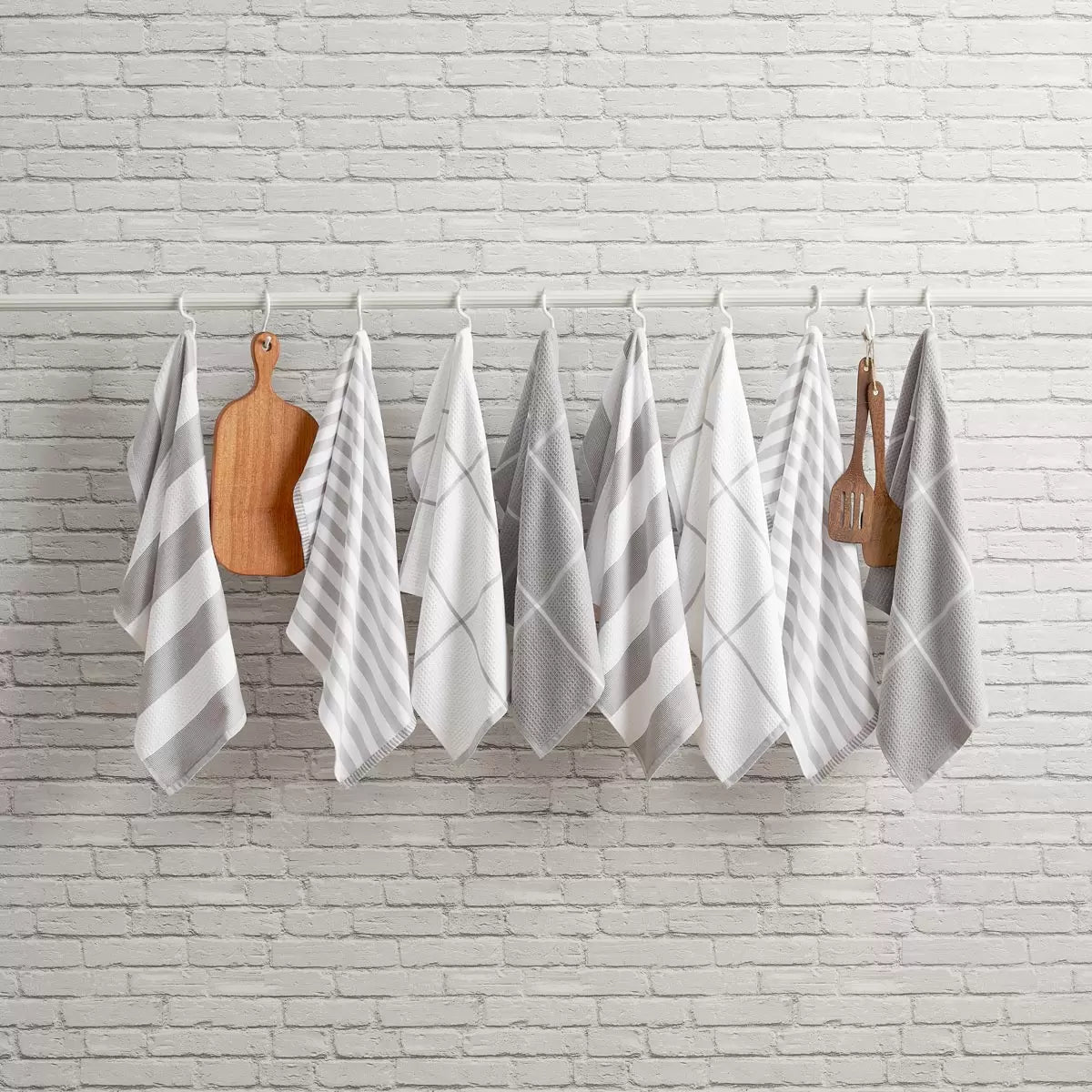 Pack of eight Caro Home kitchen towels in three assorted colours displayed for kitchen cleaning and drying.
