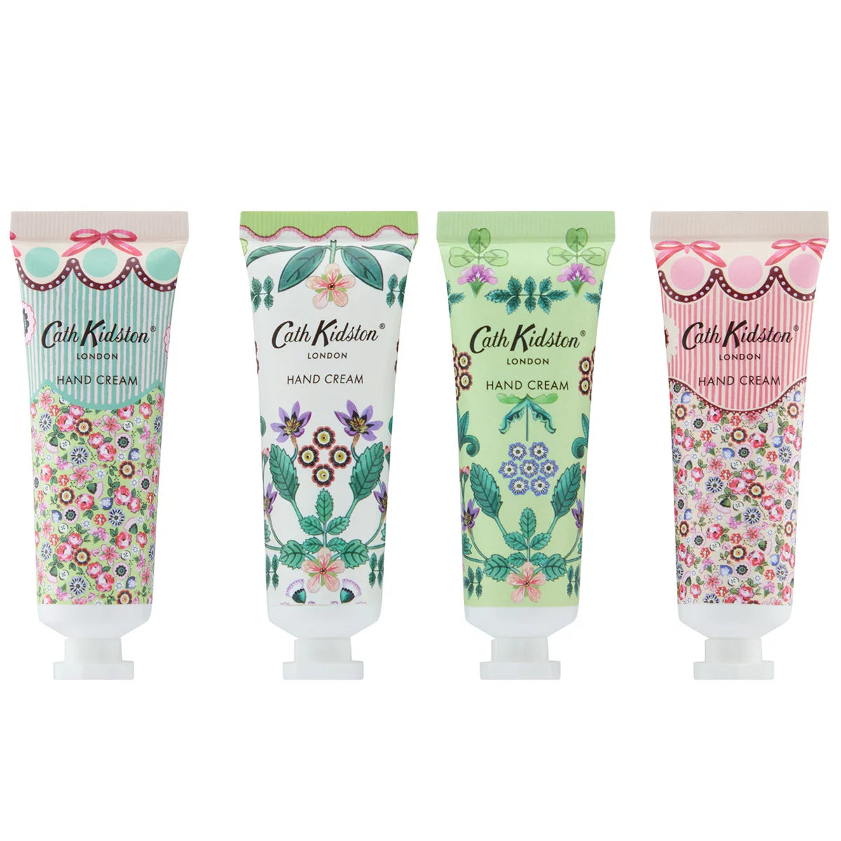 Flat lay arrangement of eight colorful Cath Kidston 30ml hand cream tubes featuring hand-painted flower patterns around an opened gift box.