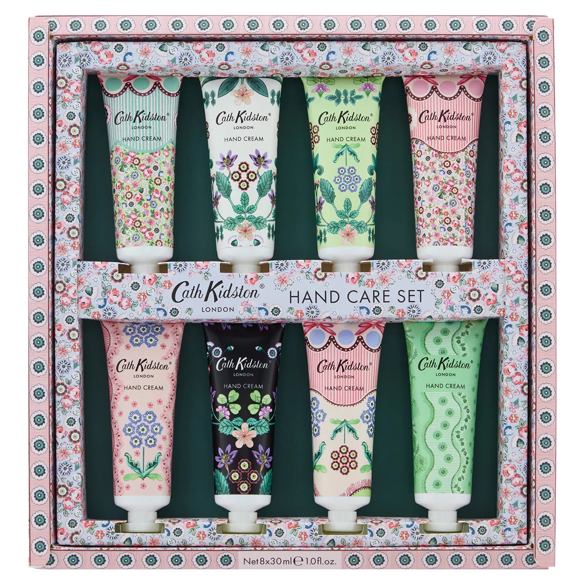 Flat lay arrangement of eight colorful Cath Kidston 30ml hand cream tubes featuring hand-painted flower patterns around an opened gift box.