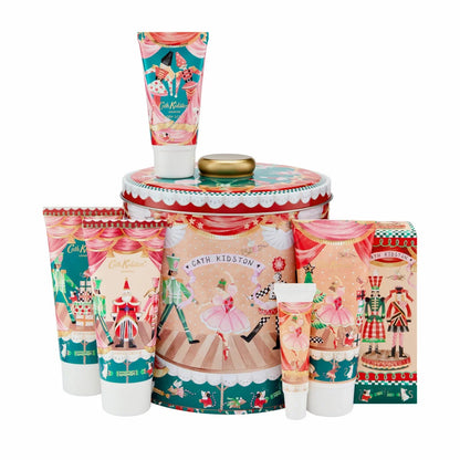 Front view of the Cath Kidston Nutcracker decorative metal tin displayed alongside six festive bath and body care products against a neutral background.