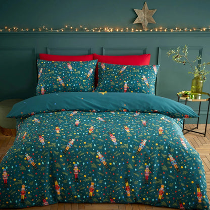 Catherine Lansfield Christmas nutcracker duvet cover set in deep green styled neatly on a bed with matching pillowcases.