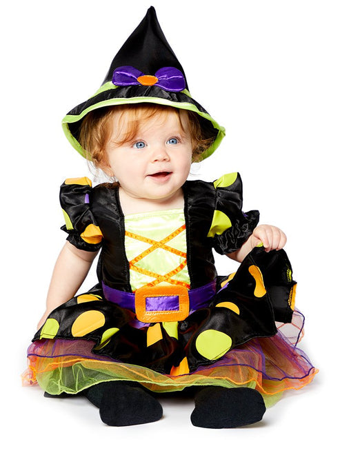 Front view of the Cauldron Cutie baby witch costume featuring a dotty polka-dot dress, colorful tulle skirt, and matching pointed witch hat with a purple bow.