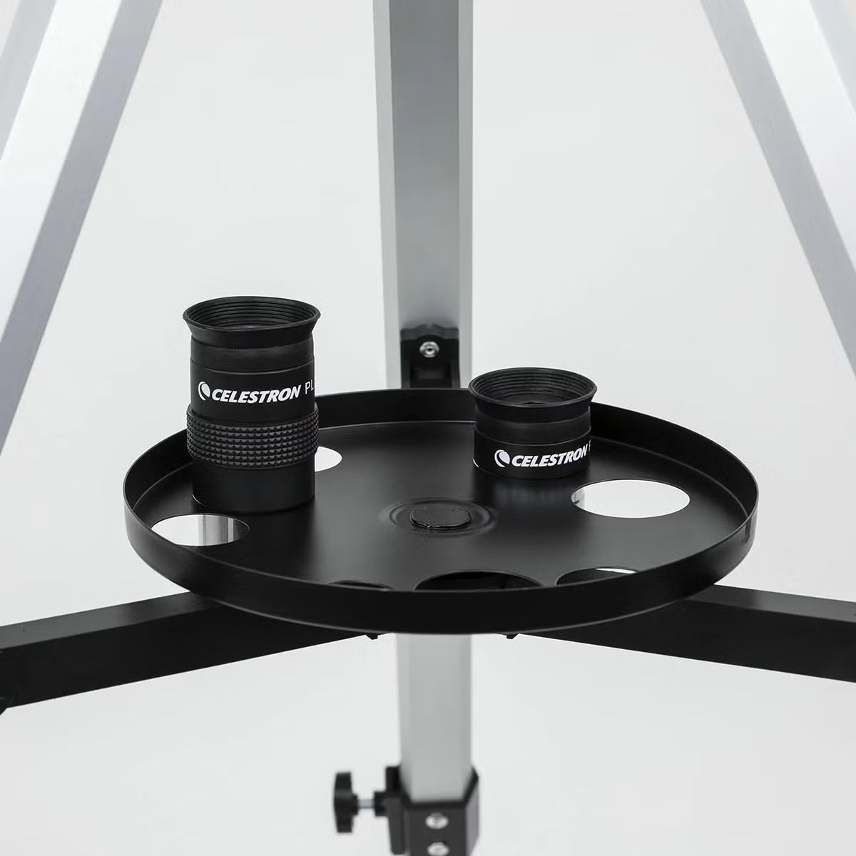 Carbon fibre finish Celestron 114AZ-SR reflector telescope on an aluminum tripod with a smartphone mounted to the eyepiece.