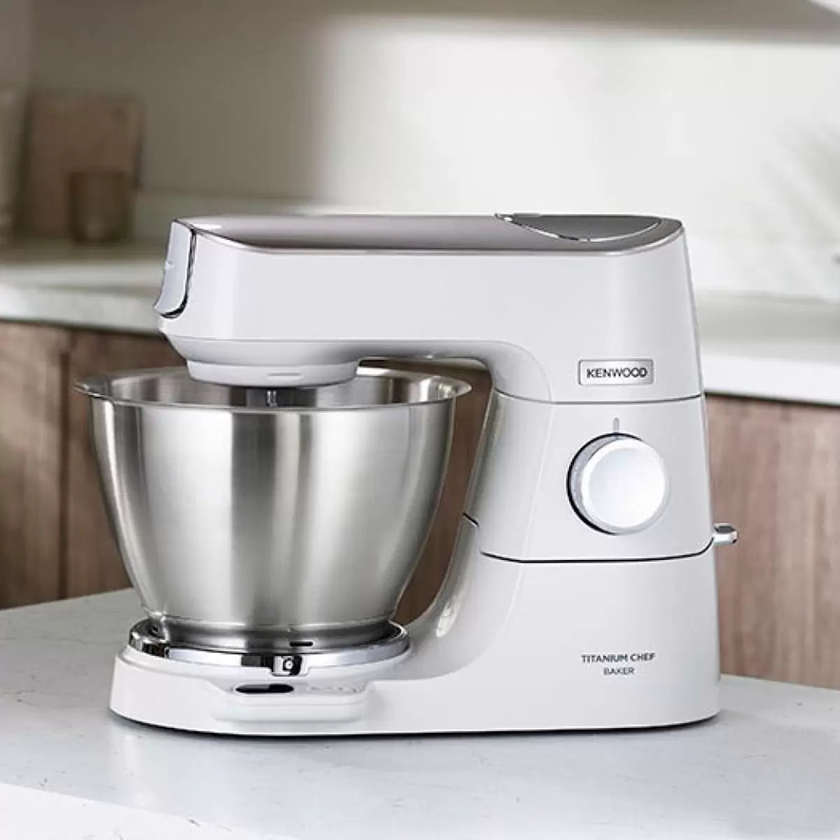 Achieve precise baking with the Kenwood Titanium Chef Baker Stand Mixer. Built-in EasyWeigh™ scales, 5L stainless steel bowl, powerful motor, and planetary mixing action.
