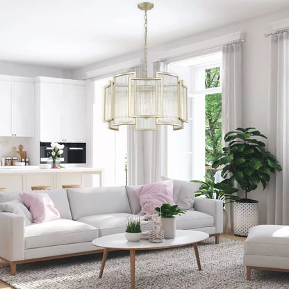 A 56cm wide Chicago five-light ceiling chandelier with a warm matte gold metal frame and tiered, hanging clear glass rods, suspended by an adjustable chain in a modern high-ceilinged entryway.