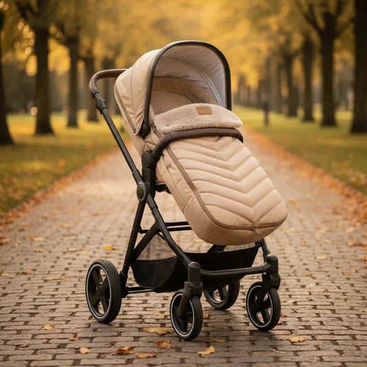 Clair De Lune Snug Universal Pushchair Footmuff featuring cozy teddy fleece lining, securely fitted to a modern baby stroller.