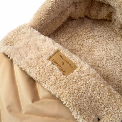 Clair De Lune Snug Universal Pushchair Footmuff featuring cozy teddy fleece lining, securely fitted to a modern baby stroller.
