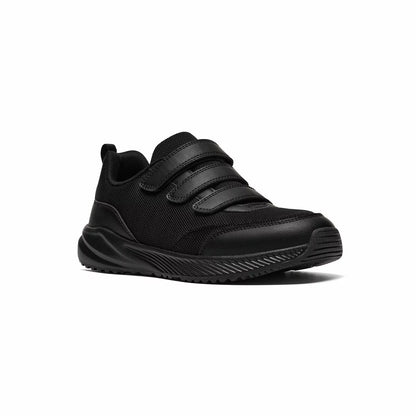 Side profile of the black Clarks Kids Deyes Coast Trainer featuring dual riptape straps, padded collar, and reinforced toe bumper on a clean background.