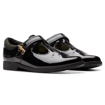 Side angle view of Clarks Kids Lock Shine black patent T-bar school shoes featuring a buckle accent and grippy rubber sole.
