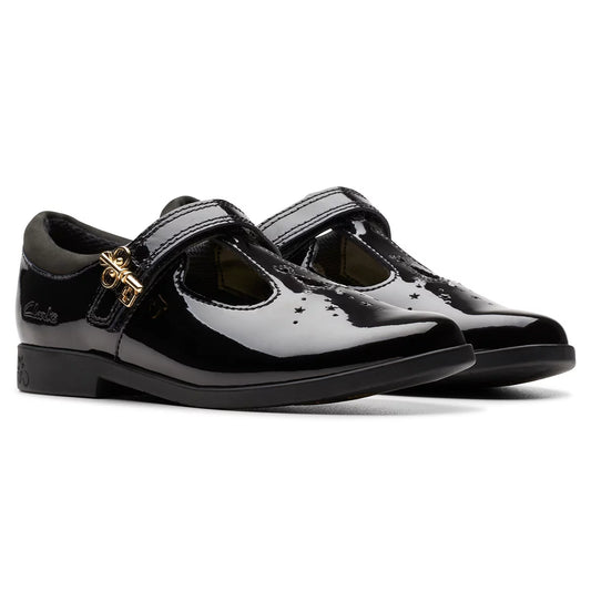 Side angle view of Clarks Kids Lock Shine black patent T-bar school shoes featuring a buckle accent and grippy rubber sole.