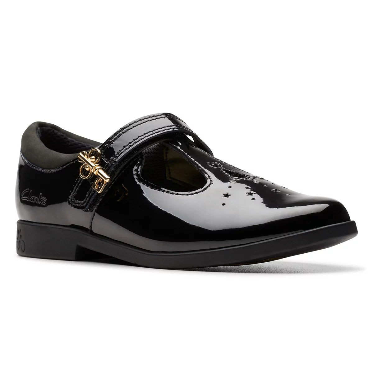 Side angle view of Clarks Kids Lock Shine black patent T-bar school shoes featuring a buckle accent and grippy rubber sole.