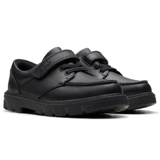 Side view of Clarks Kids Lorcam Edge Black Leather School Shoes featuring elastic laces, a secure riptape strap, and a flexible dark rubber sole.
